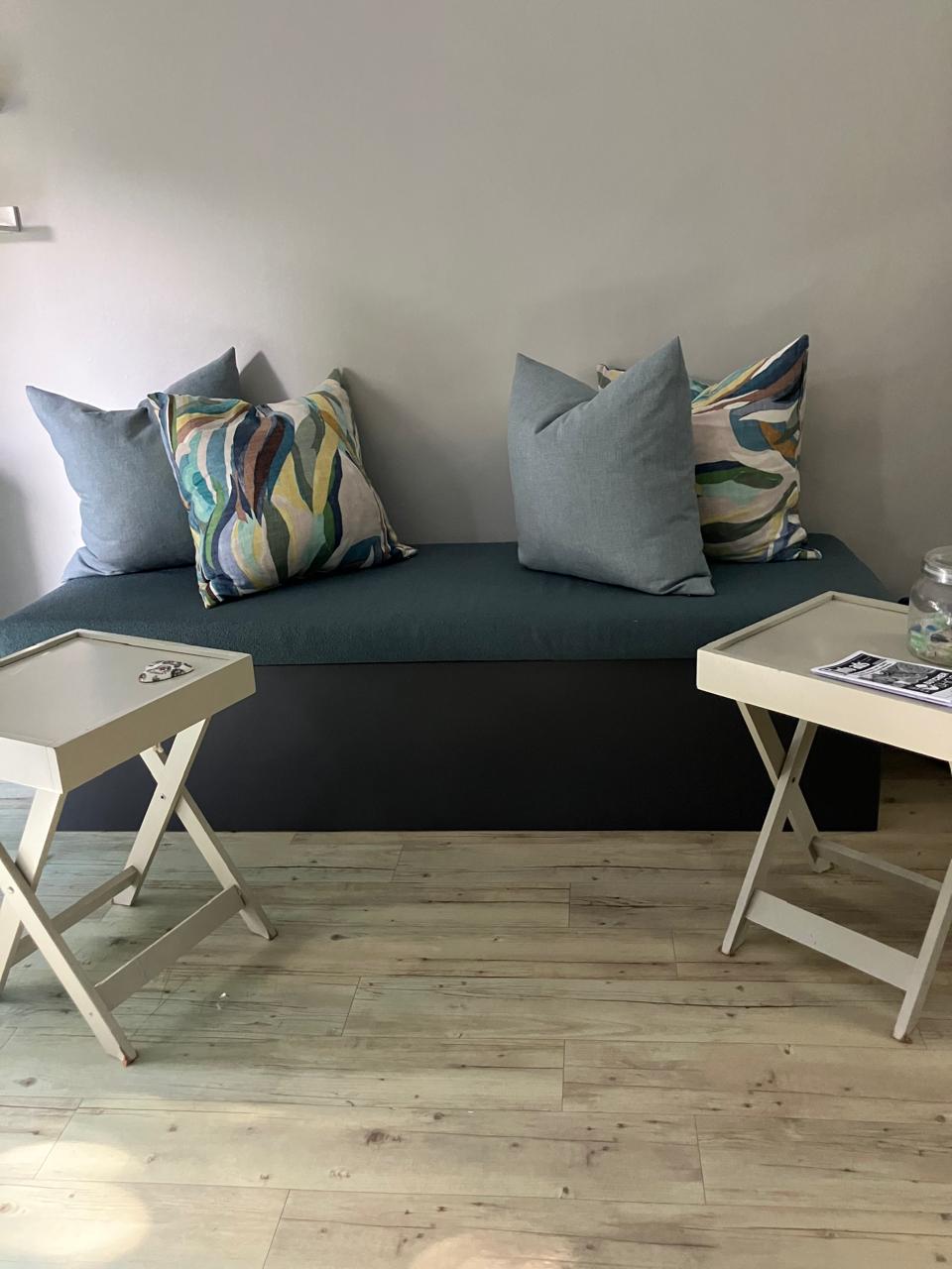 Sage waiting bench with linen cushions